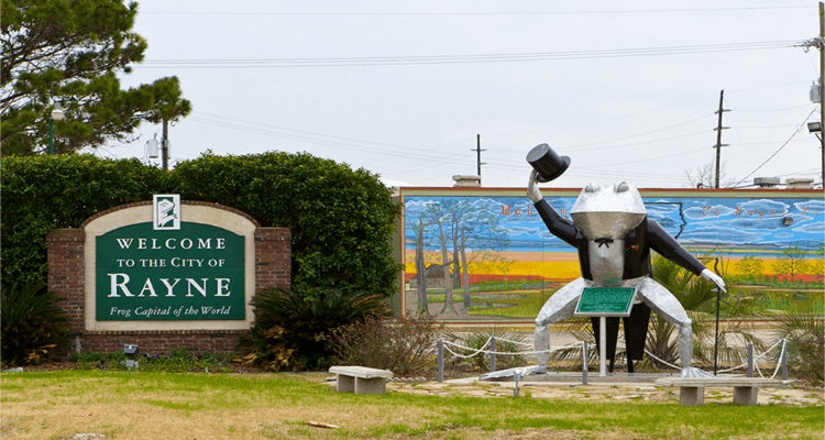 Rayne LA Welcome Sign and Frog Frog statue and mural in Rayne, Louisiana, the Frog Capital of the World